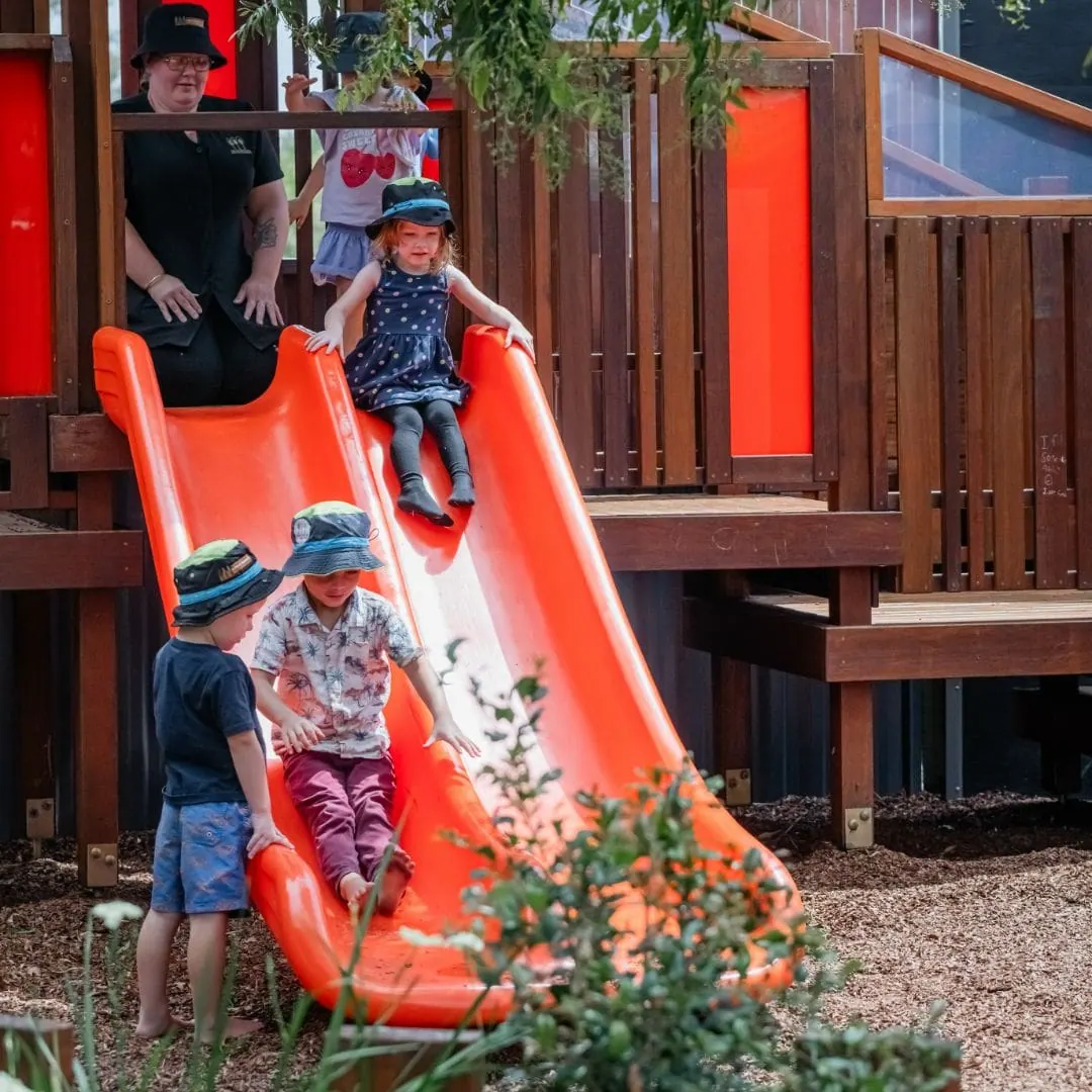 Wooden A-frame climbing structure in the natural outdoor play yard at Natural Elements Eagleby