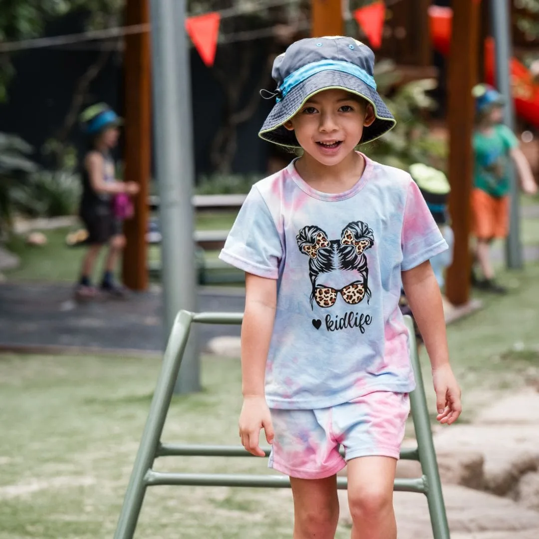 Child making her way across the outdoor obstacle course in the Eagleby playground